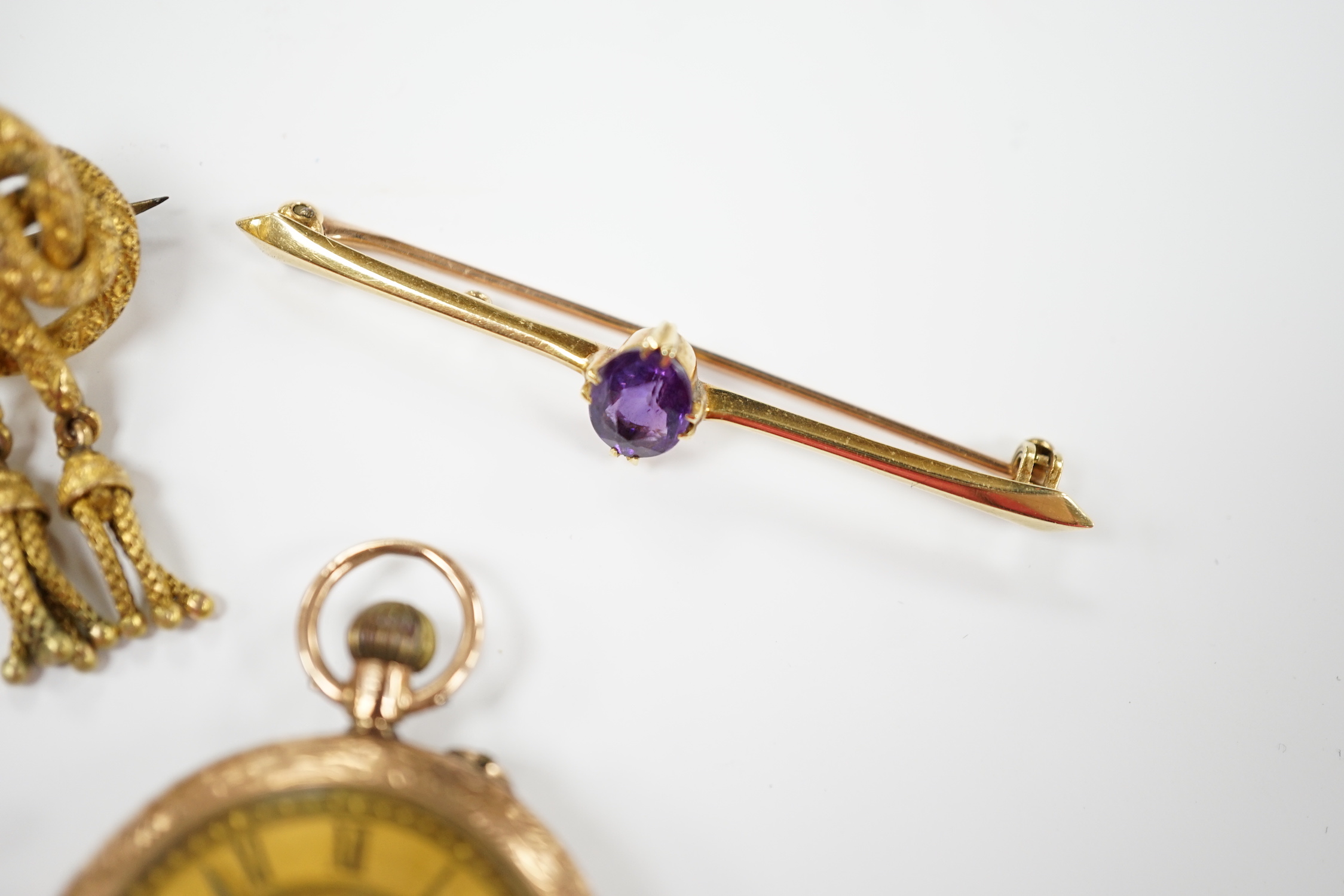 A group of assorted jewellery including a 15ct and single stone amethyst bar brooch, three other yellow metal and gem set bar brooches including two 9ct, a 9ct and enamel brooch, an 18ct watch, a 9ct fob watch and two ot